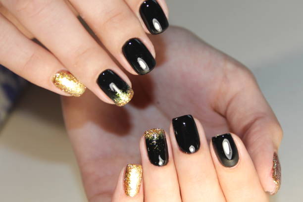 istock manicure design black and gold color 854999162