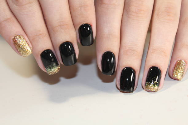 istock manicure black and gold 854999236