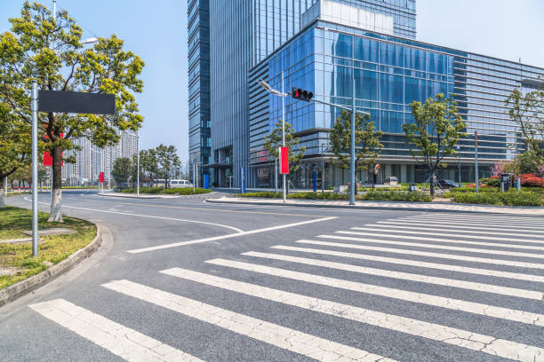 istock urban road through city buildings 854999614
