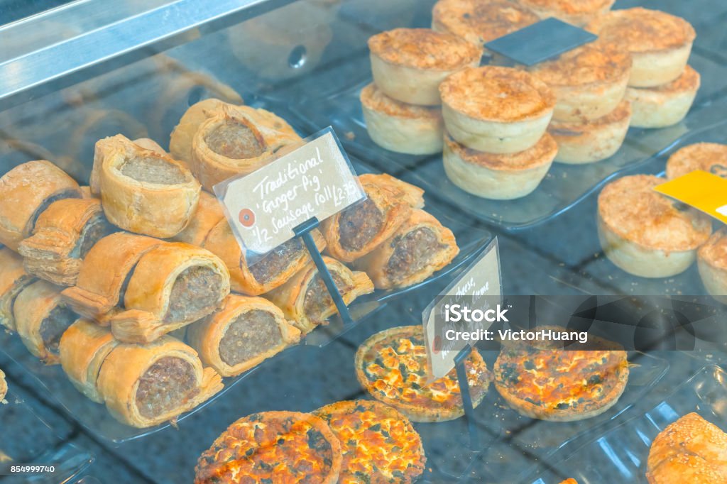 Traditional English sausage rolls and pies on display Traditional English sausage rolls and pies on display for sale Sausage Roll Stock Photo