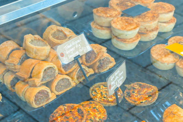 Traditional English sausage rolls and pies on display Traditional English sausage rolls and pies on display for sale brixton photos stock pictures, royalty-free photos & images