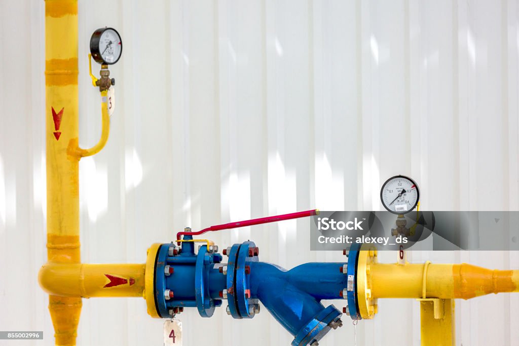 Yellow Pipeline with couple of pressure gauges on it Yellow Stock Photo