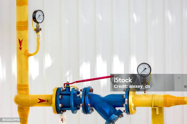 Yellow Pipeline With Couple Of Pressure Gauges On It Stock Photo - Download Image Now