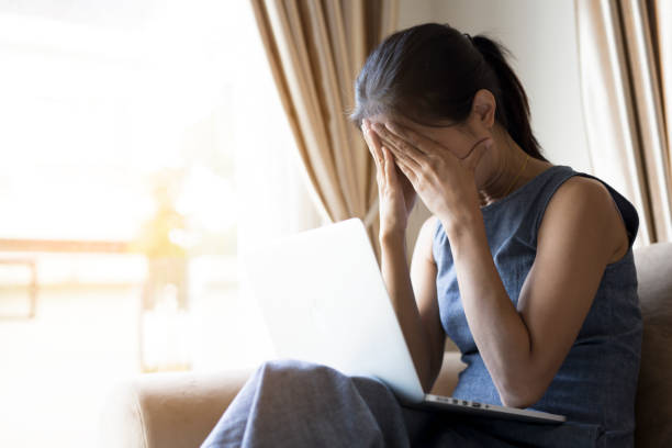 istock Women sit stressed. She felt a headache.Hard work concept..Hard work concept. 855006866