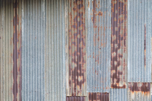 istock Old rusty corrugated tin zinc metal wall in vintage tone. 855014414