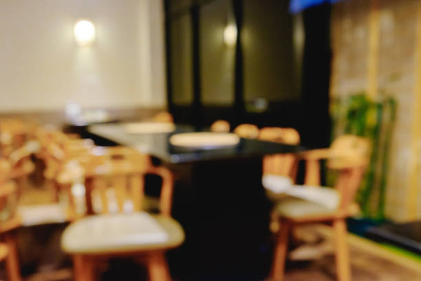 istock Abstract blurred Shabu and BBQ restaurant interior with empty table sets and light bokeh. 855014612
