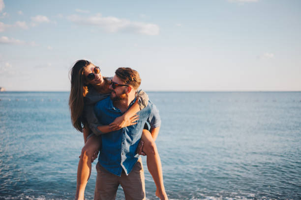 istock Piggybacks are always fun to do on the beach 855018078