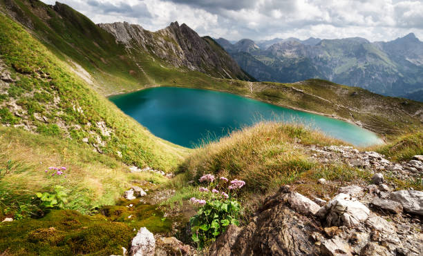 istock sunshine over turquoise alpine lake in summer 855022222