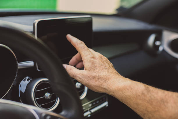 istock Senior man in car. Senior man driving car and using navigation. Close up. 855022878