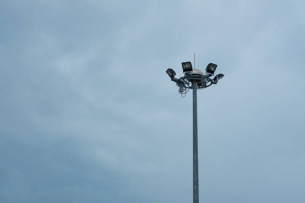 istock Lamp post electricity industry with blue sky background. Spotlight tower. 855031180