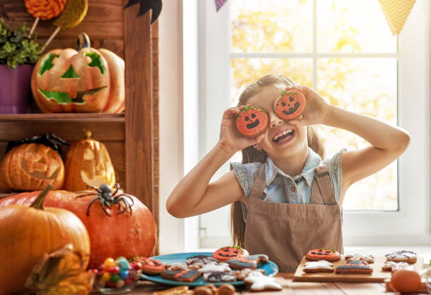 istock girl with carving pumpkin 855032140