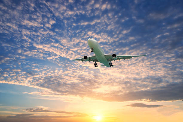 istock Commercial jet aeroplane flying above clouds