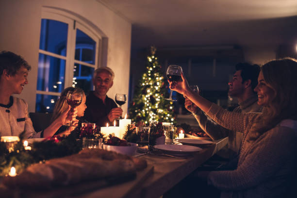 istock Extended family toasting wine at christmas dinner 855045736