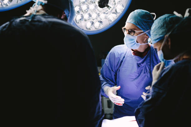 istock Group of doctors at work in hospital operation theater 855045940