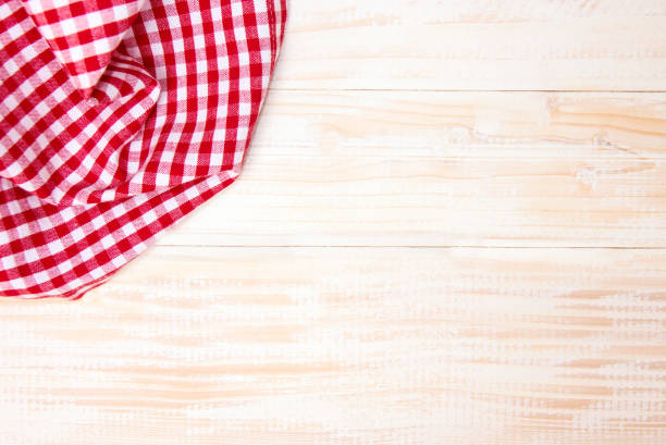 istock The checkered tablecloth on wooden table. 855046342