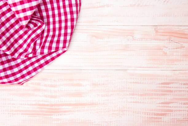 istock The checkered tablecloth on wooden table. 855046360