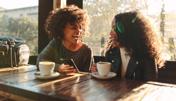 istock Two women having fun at a coffee shop 855046456
