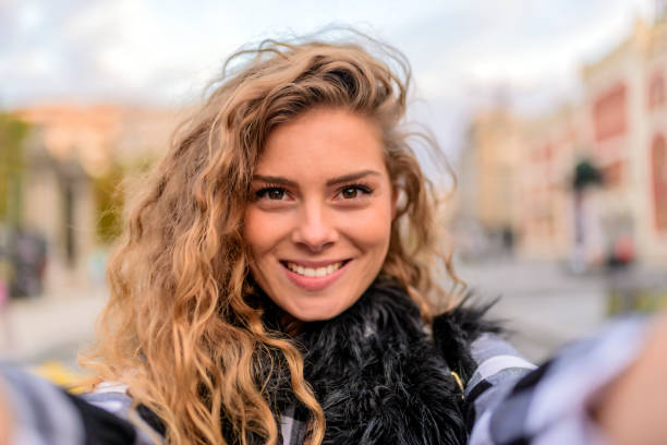 istock Smiling woman taking a selfie photo 855046652