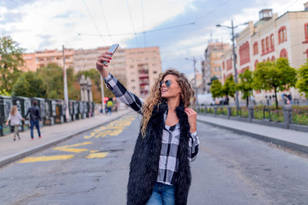 istock Smiling woman taking a selfie photo 855049846