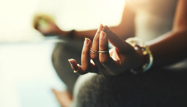 Shot of a young woman practicing yoga in the studio