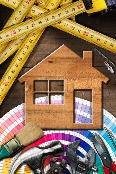 home improvement concept - work tools and house - tape measure home improvement measuring wood imagens e fotografias de stock