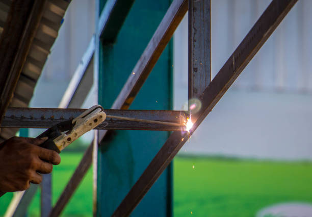 istock Industrial welder in a small factory 855053054