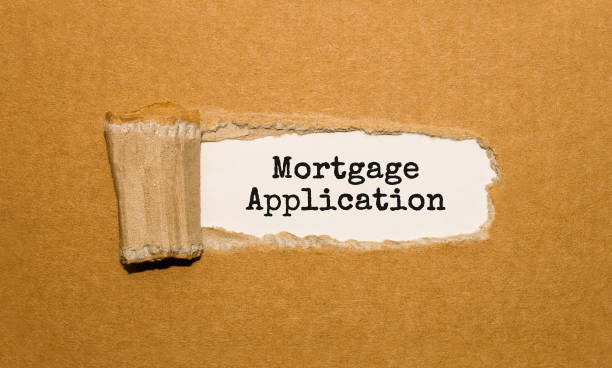 istock The text Mortgage Application appearing behind torn brown paper 855054356