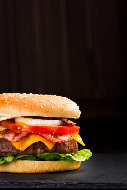 istock Delicious hamburger on a dark background 855055994
