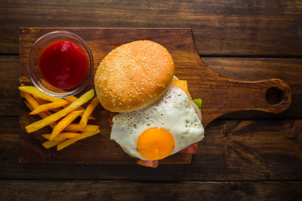 istock Delicious hamburger with french fries on a rustic table 855060504