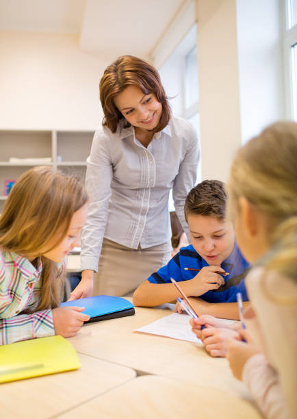 istock group of school kids writing test in classroom 855062044