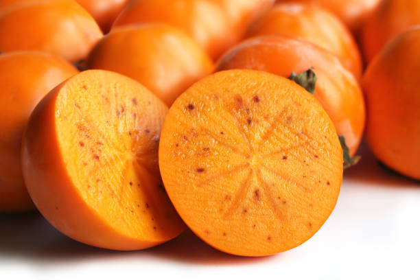 Macro of Persimmons Persimmons Backgorund Persimmon stock pictures, royalty-free photos & images