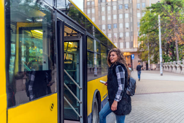 istock Young woman stepping into the bus 855062930