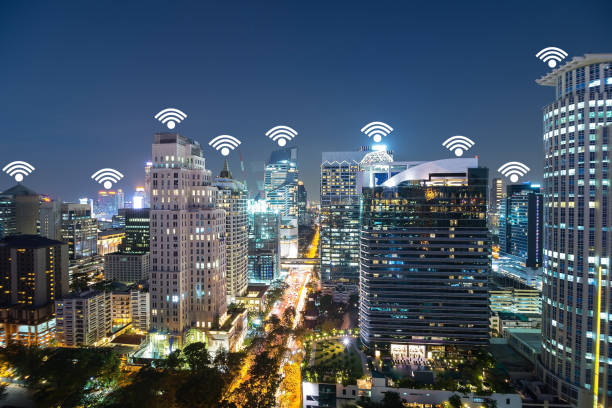 istock Internet network connection and telecommunication. City lifestyle people use digital data transfer, social network via wifi connection. Wifi Icon on Cityscape in twilight as Background. 855066070
