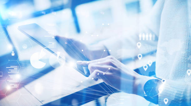 istock Concept of virtual screen,digital connection icon and graph interfaces.Young businesswoman working on modern mobile tablet while sitting at work place at sunny office.Blurred background. 855066856