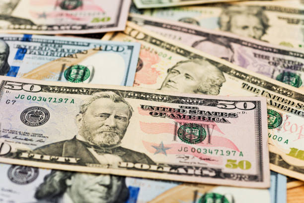 istock Group of dollar bills background 855067054