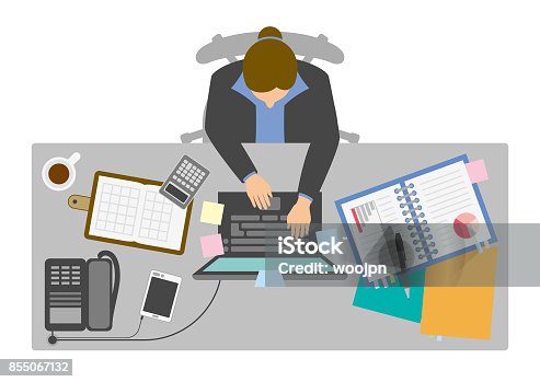 istock Businesswoman working at desk from above 855067132
