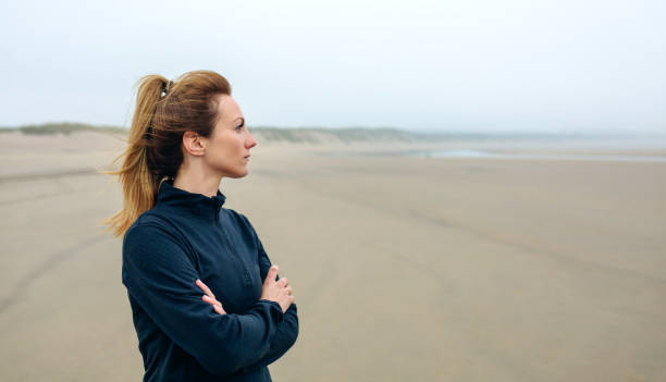 istock Woman looking at sea 855069730
