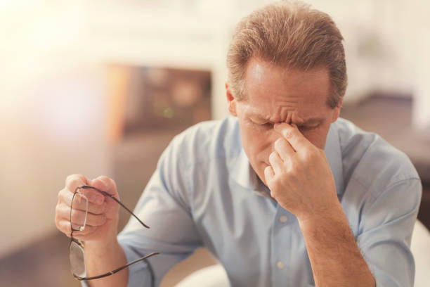 istock Depressed mature man feeling tired in the office 855070228
