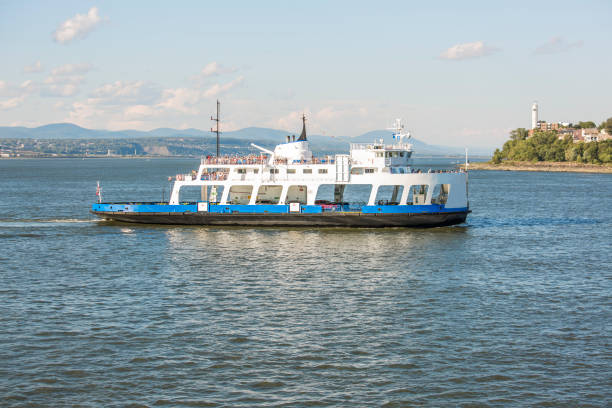 istock Ferry boat in river in Quebec City with blue sky 855070276