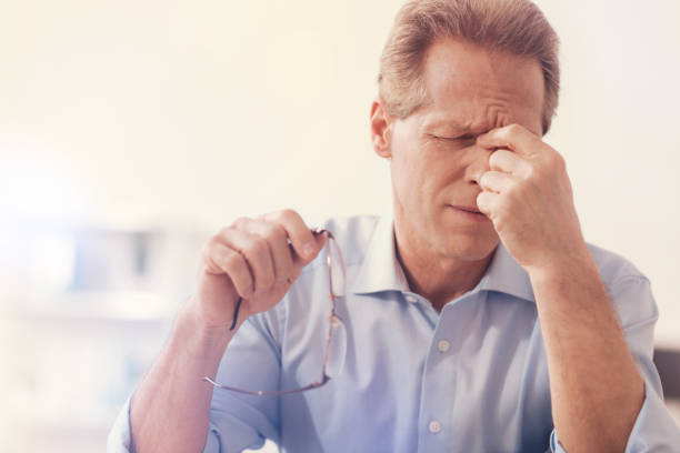 istock Depressed male office worker having aheadache 855070318