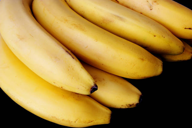 istock ripe bananas isolated on black 855070522