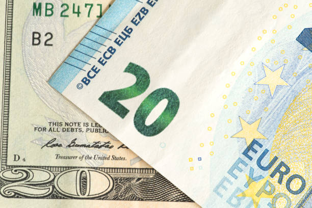 istock Banknotes 20 euros and 20 dollars 855073050