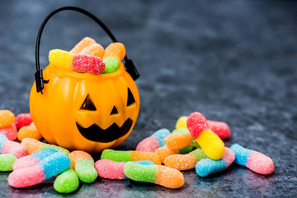 istock Halloween pumpkin with sweet candy 855078170
