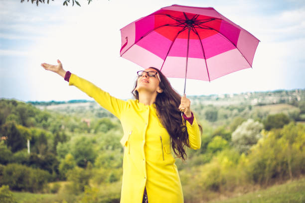 istock Beautiful young woman enjoying a rainy day 855081430