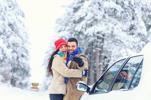 istock Couple having fun in snow forest 855082782