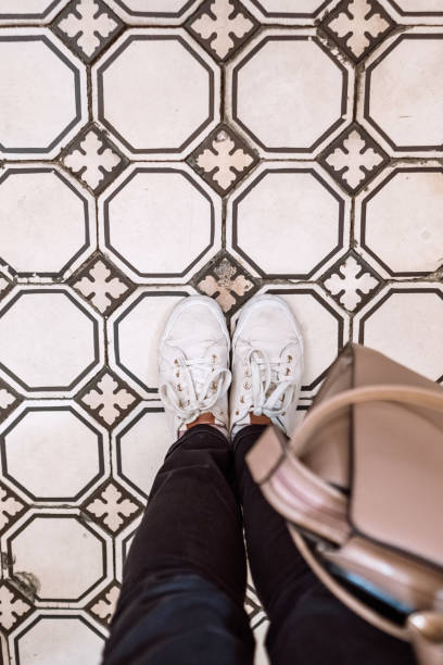 istock Woman standing on beautiful tiled floor 855085676