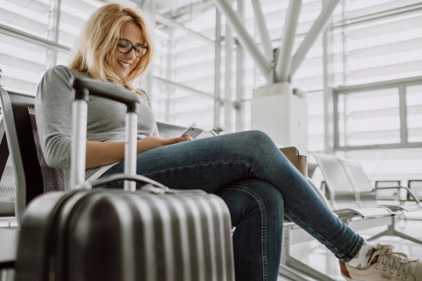 istock Woman using internet on airport 855086612