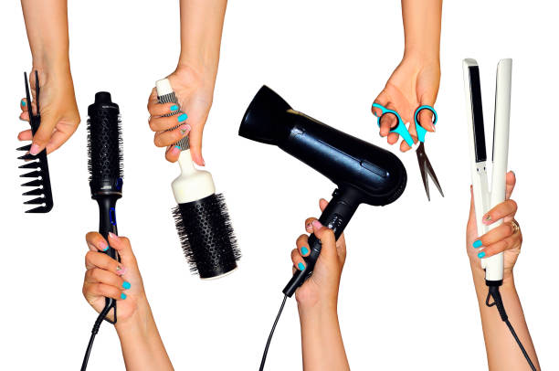istock Tools for styling the hair holding in hands isolated on white background 855098264