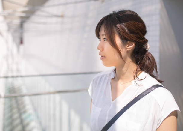 istock Pure woman standing in while building 855098428