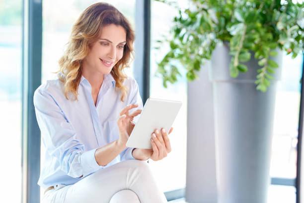 istock Businesswoman with digital tablet 855113462
